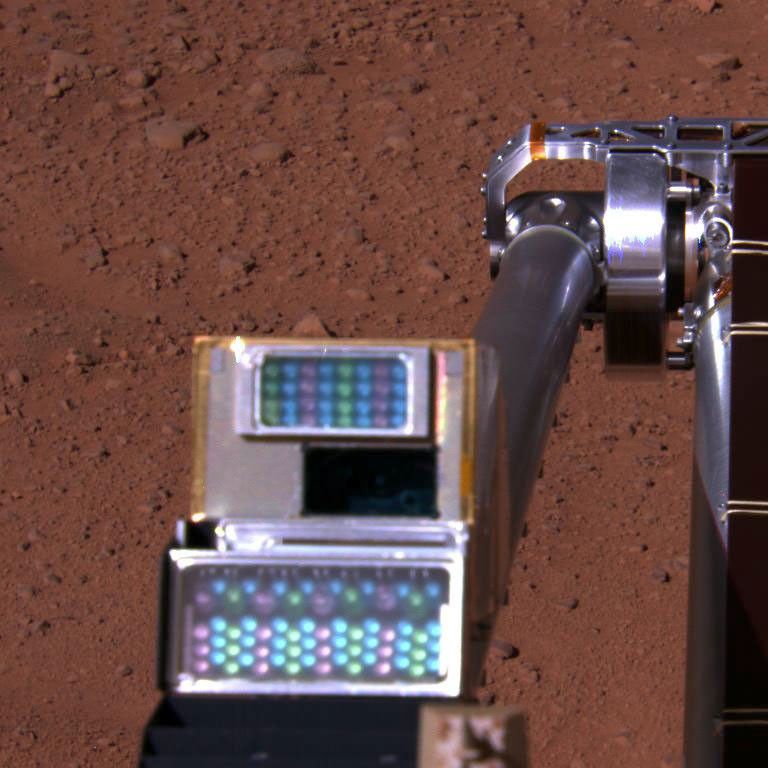 This approximate color image is a view of NASA's Phoenix Mars Lander's Robotic Arm Camera taken on the afternoon of Sept. 22, 2008. This yields proper coloring when imaging Phoenix's surrounding Martian environment.