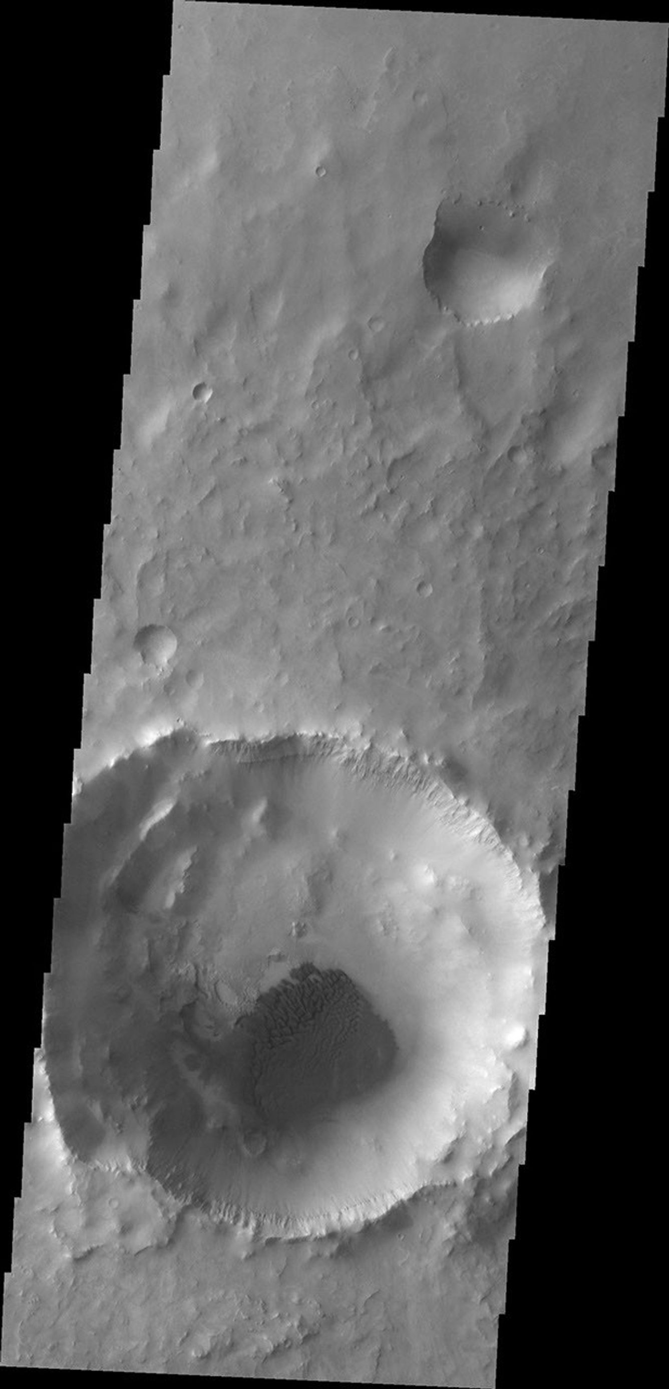 This image from NASA's Mars Odyssey shows dark dunes located on the floor of this unnamed crater in Meridiani Planum.