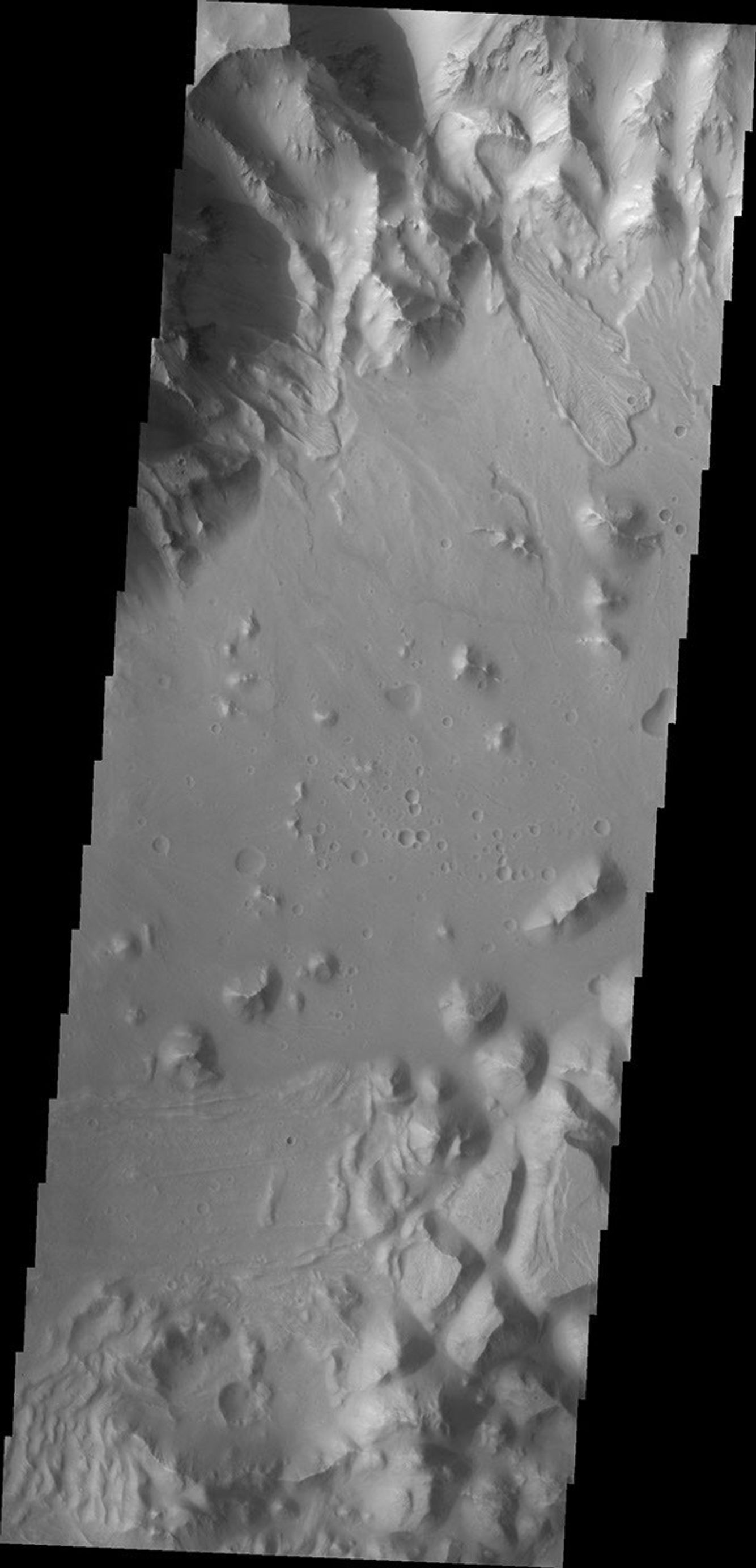 This image from NASA's Mars Odyssey shows a portion of the northern rim of Orson Welles Crater contains several landslides.