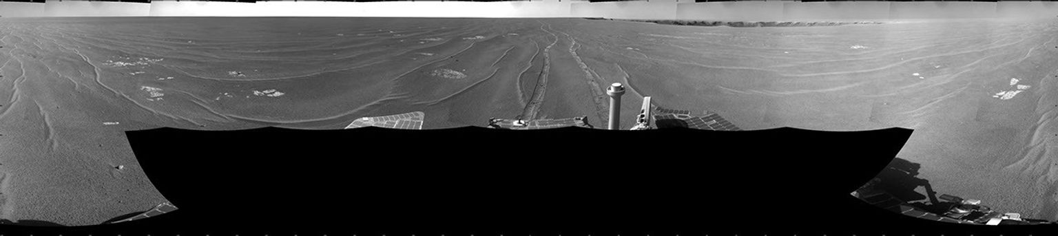 NASA's Mars Exploration Rover Opportunity took this full-circle view of the rover's surroundings on Sept. 28, 2008. The rover's parallel tracks are in view as is Victoria Crater.