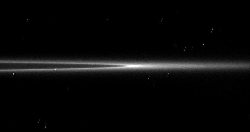 Seen from a viewpoint nearly coincident with the ringplane, the bright arc within the G ring appears even brighter with its ring material concentrated in the center of this image taken by NASA's Cassini spacecraft on Jan. 28, 2009.