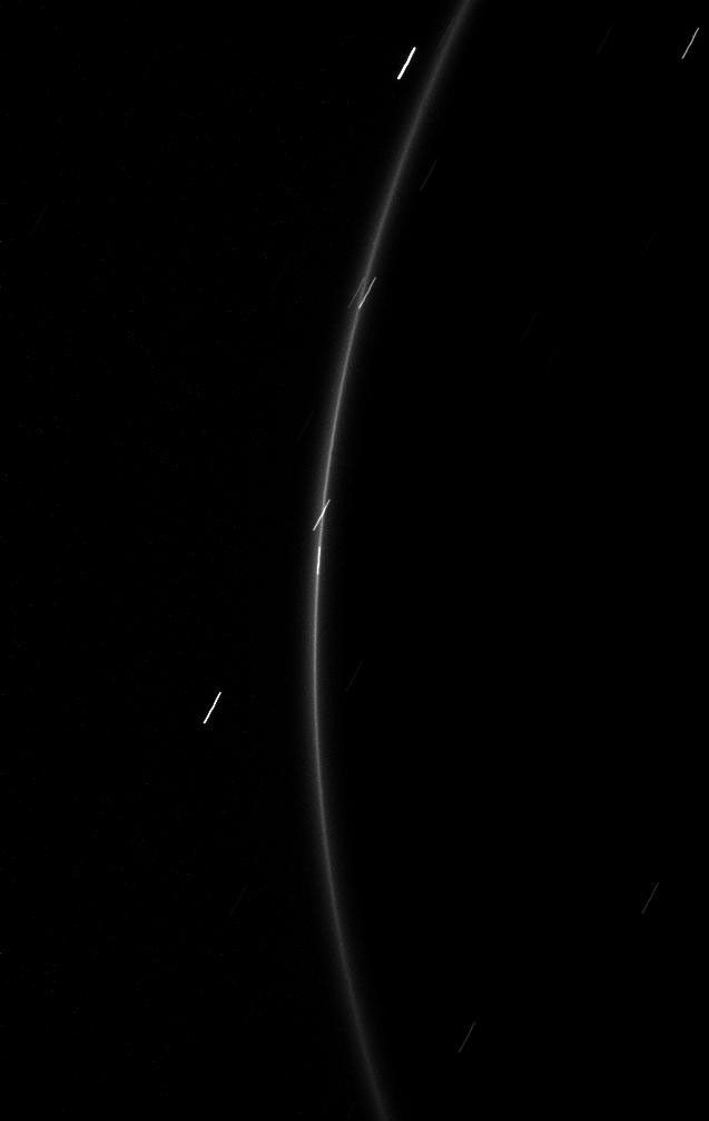 The faint G ring surrounding Saturn offers up a glimpse of its newfound tiny moonlet in this image from NASA's Cassini spacecraft taken on Feb. 20, 2009.