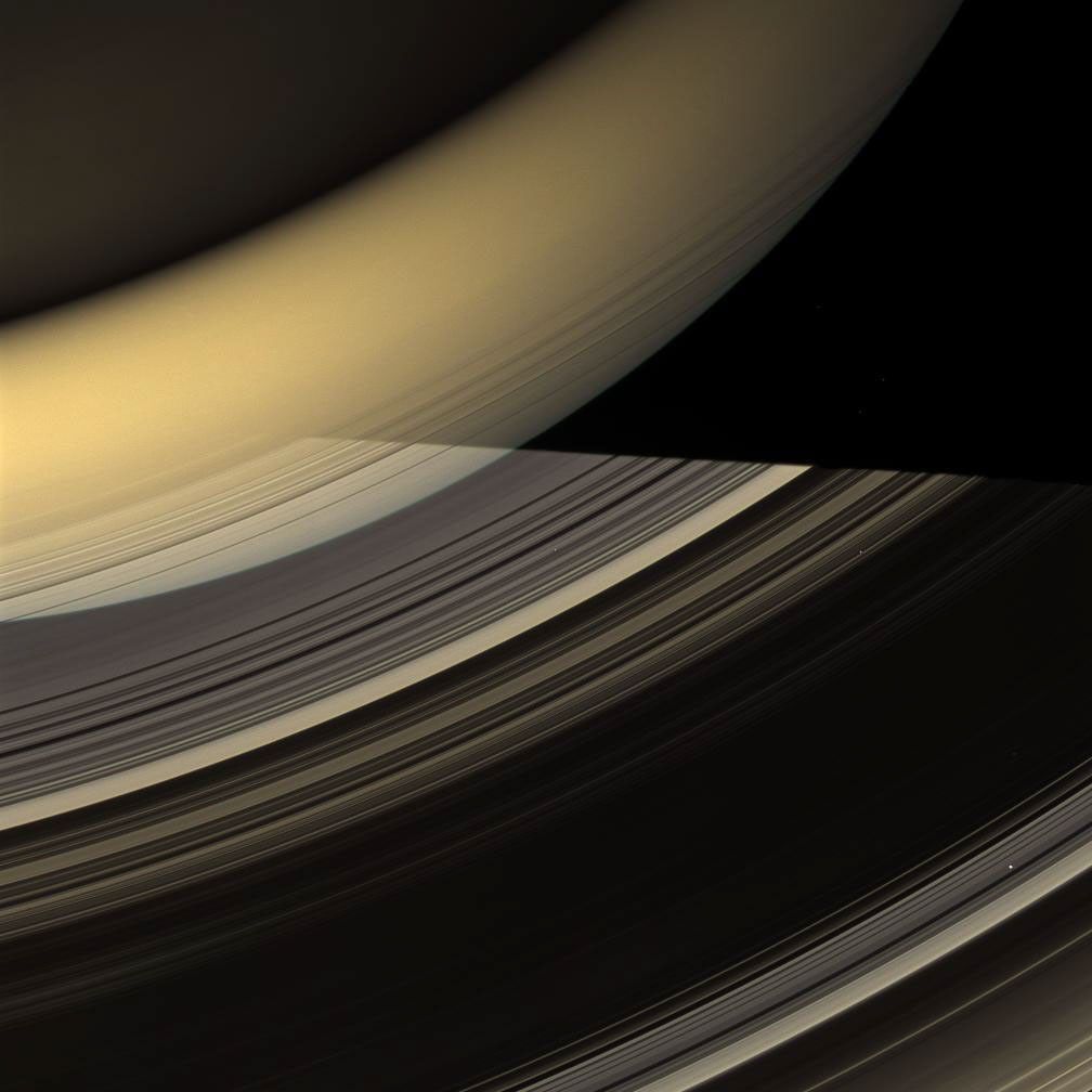 Rays of light from the sun have taken many different paths to compose this glorious image of Saturn and its rings taken by NASA's Cassini spacecraft on March 20, 2009.