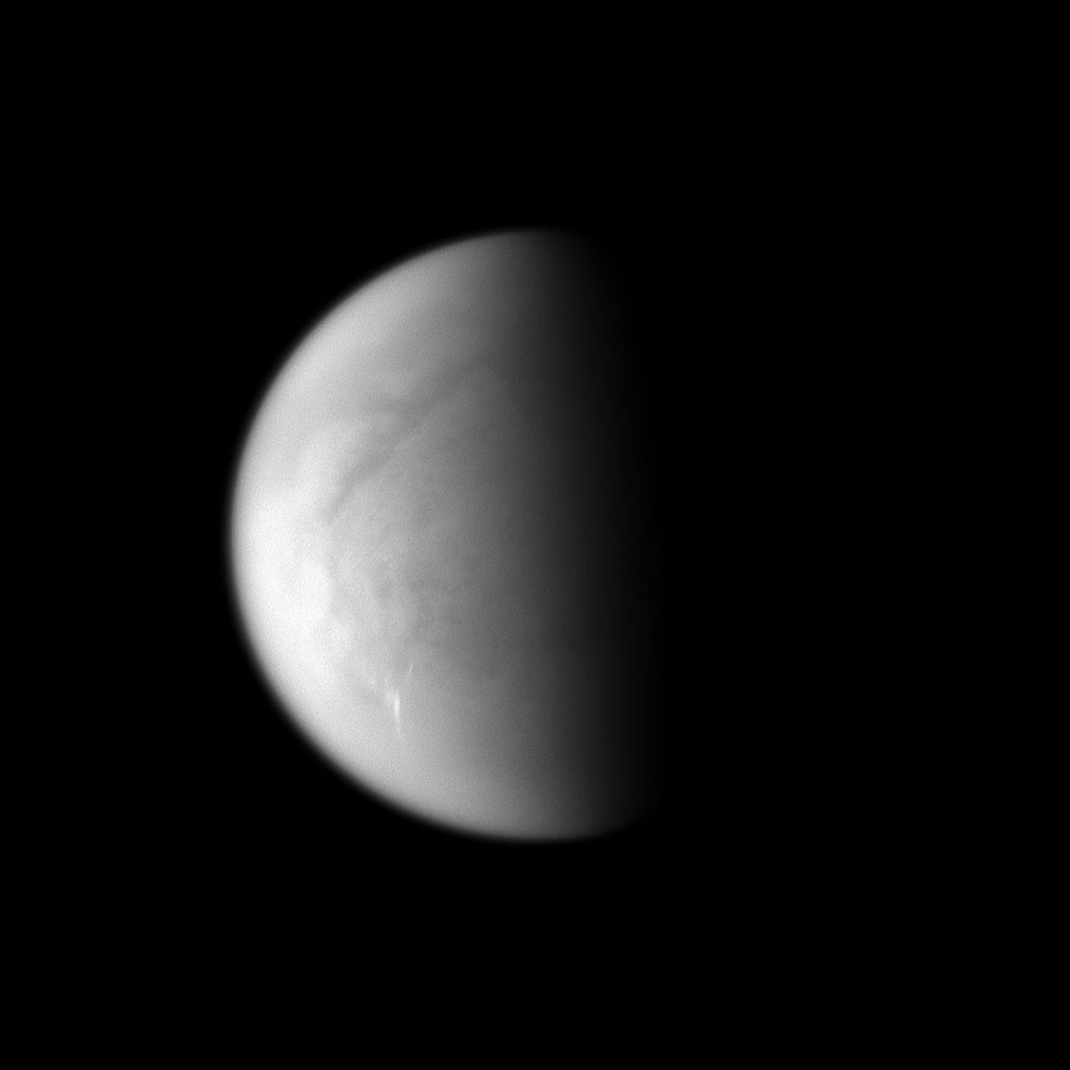 Cloud streaks stand out on Saturn's largest moon, Titan. This image was taken with NASA's Cassini spacecraft's narrow-angle camera on March 24, 2009.