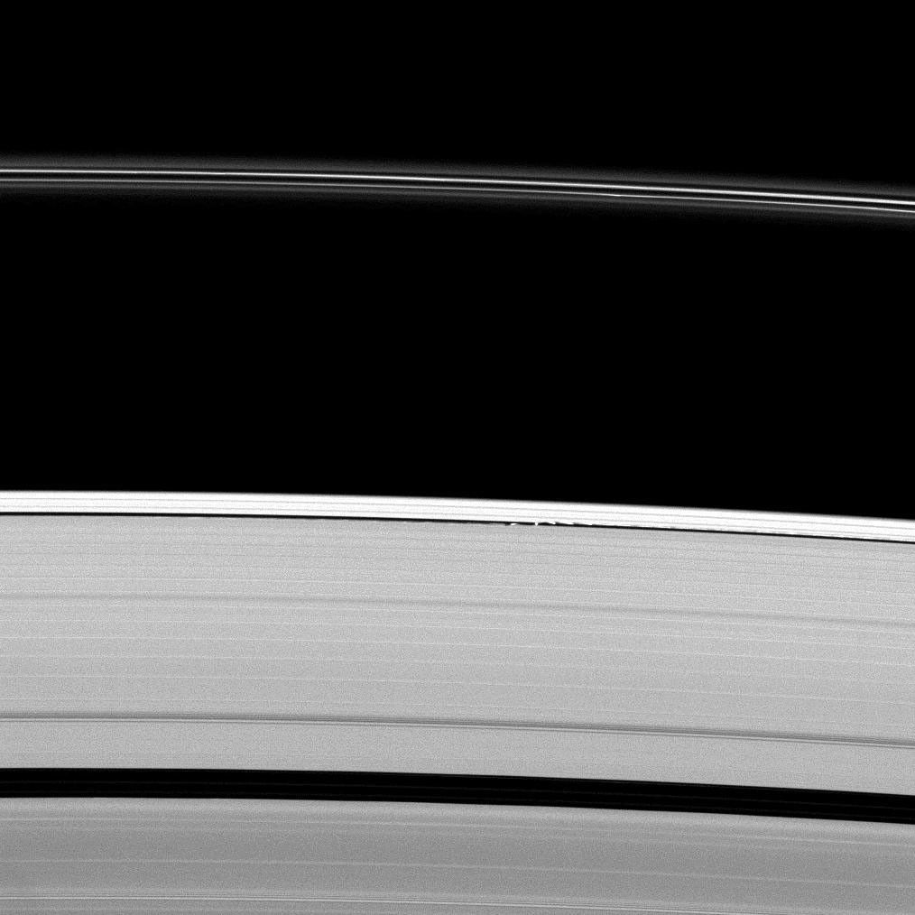 Saturn's moon Daphnis gives a scalloped look to the edge of the A ring as the moon orbits within the Keeler Gap in this image taken by NASA's Cassini spacecraft on Apr. 30, 2009.