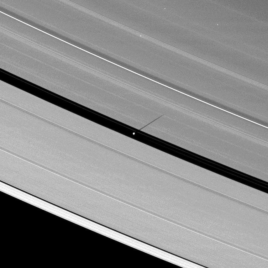 As Saturn's equinox continues to approach, the moon Pan casts a slightly longer shadow on the A ring. This image is from NASA's Cassini spacecraft.