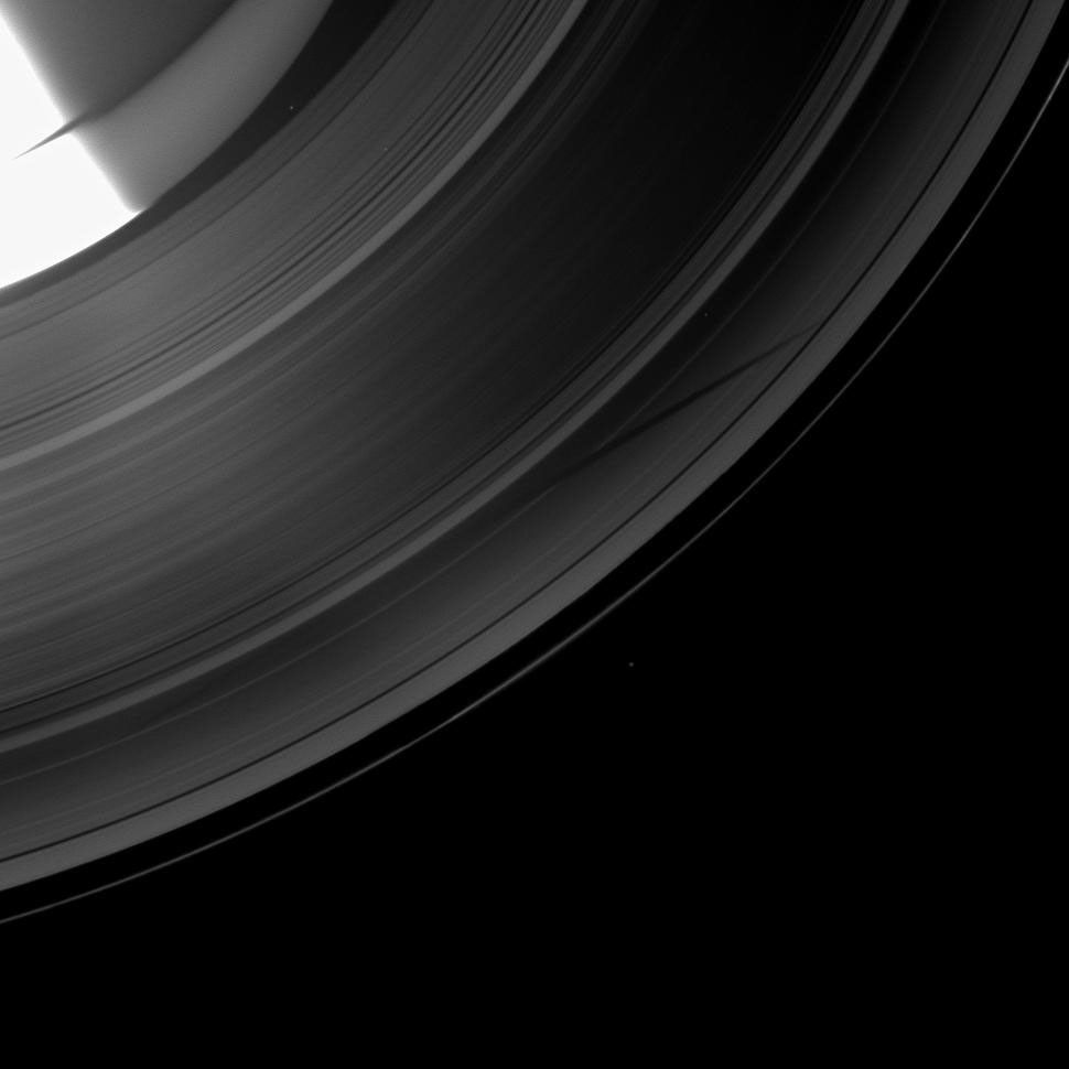 NASA's Cassini spacecraft shows a section of Saturn and its rings which includes a special treat made possible as the planet approaches its August 2009 equinox: the shadow of a moon cast on the rings.