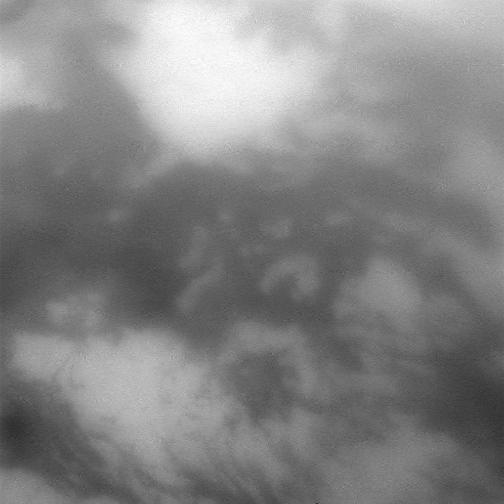 NASA's Cassini spacecraft peers through the hazy atmosphere of Titan for a close view of light and dark terrain on Saturn's largest moon.
