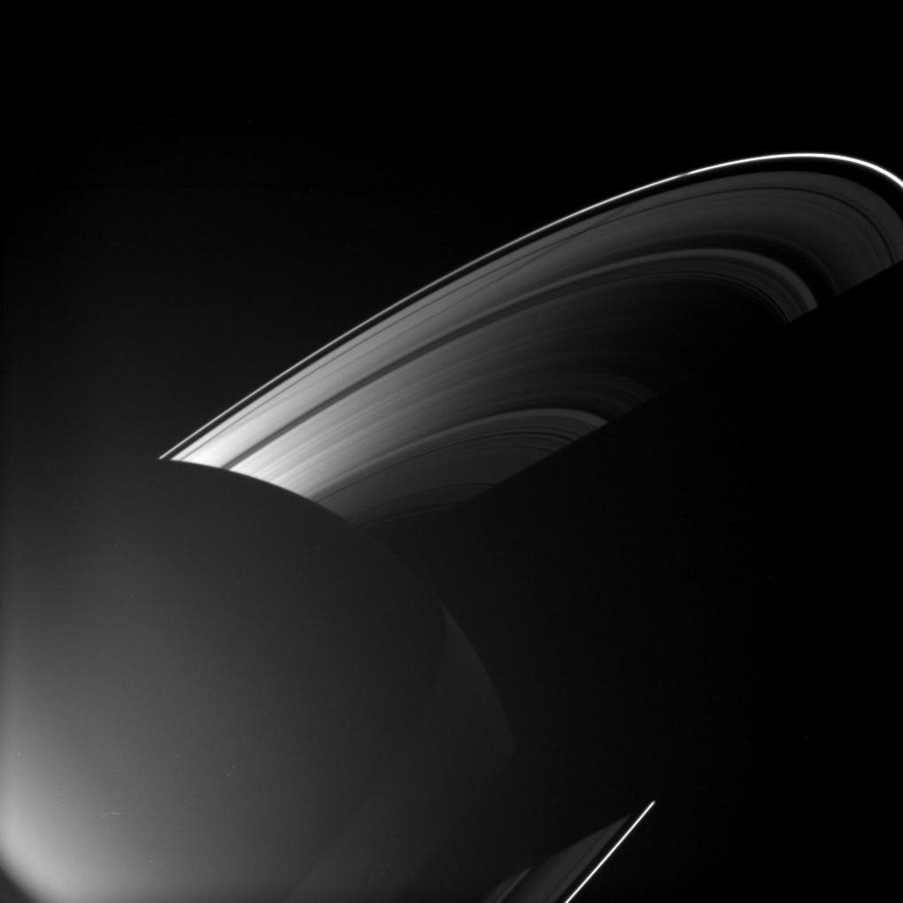 Rhea joins other Saturnian moons in casting a shadow on the rings as the planet approached its August 2009 equinox in this image taken by NASA's Cassini spacecraft's wide-angle camera.