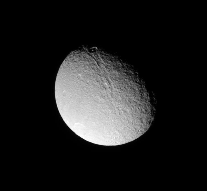 NASA's Cassini spacecraft looks down on the north of Tethys and sees brightly illuminated Penelope Crater on the trailing hemisphere of the moon in this image taken on July 27, 2009.
