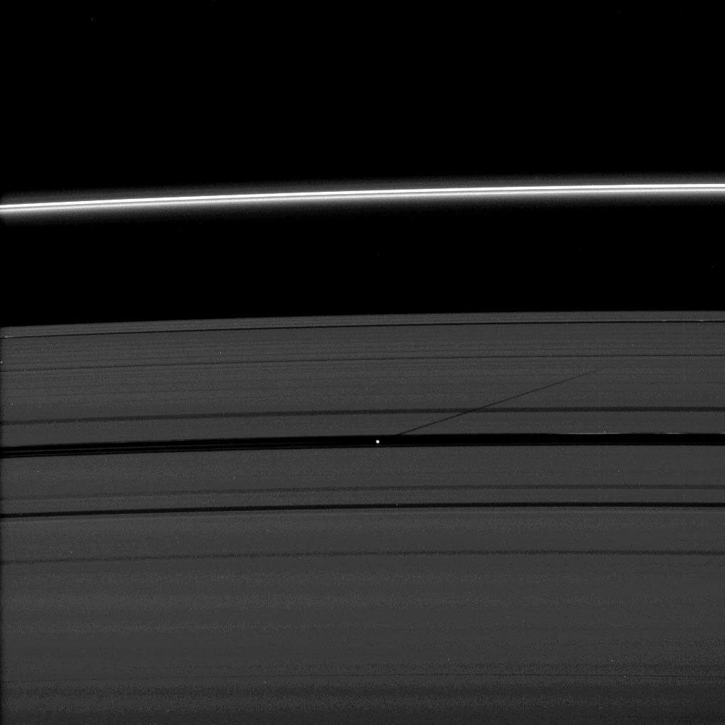 The moon Pan casts a shadow on Saturn's outer A ring in this image taken as the planet approached its August 2009 equinox. NASA's Cassini spacecraft took this image on July 29, 2009.