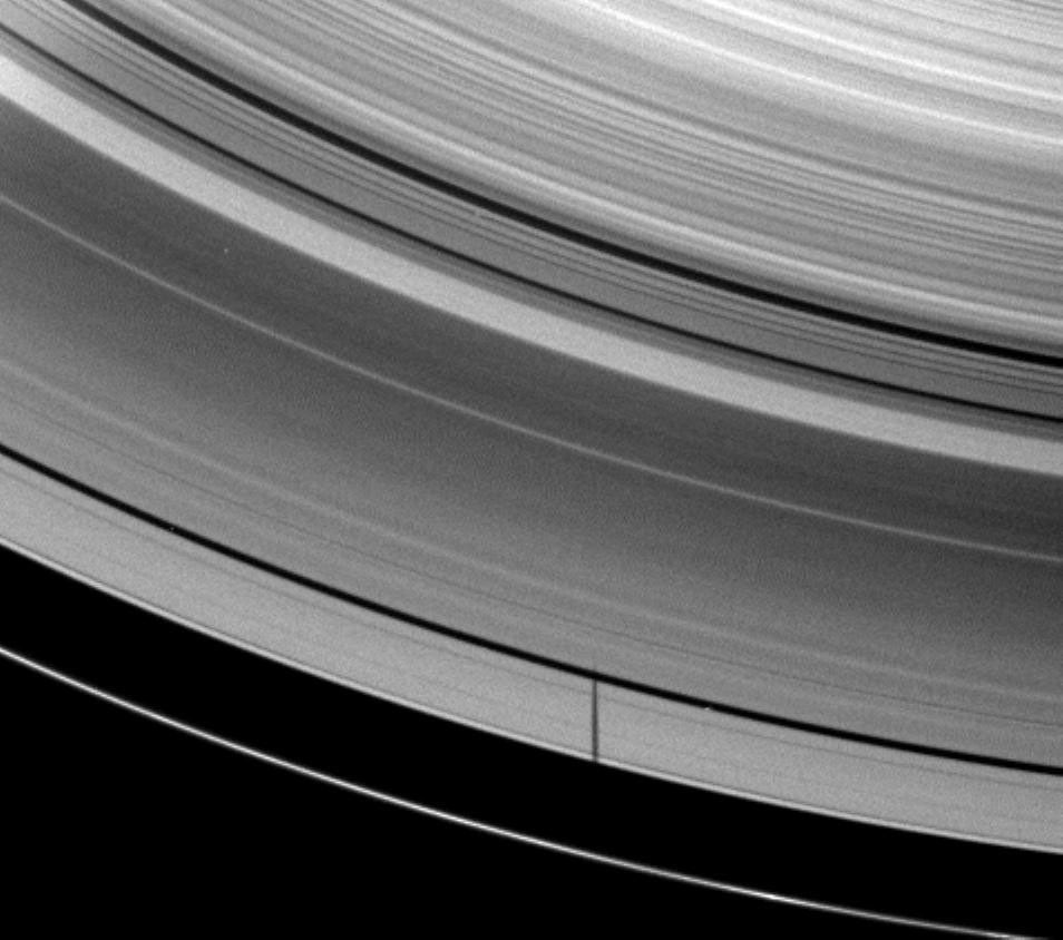 The moon Janus casts a shadow on Saturn's A ring but misses the thin F ring as the planet approached its August 2009 equinox in this image taken by NASA's Cassini spacecraft on May 28, 2009.