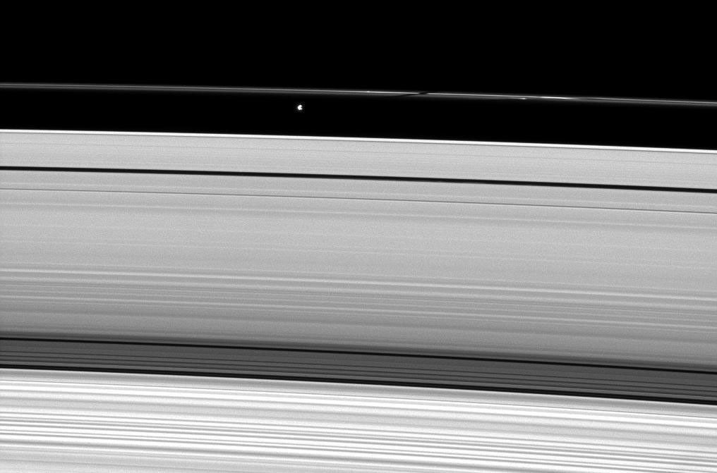 Saturn's moon Prometheus casts a shadow on the narrow F ring in this image captured by NASA's Cassini Orbiter weeks after the planet's August 2009 equinox.