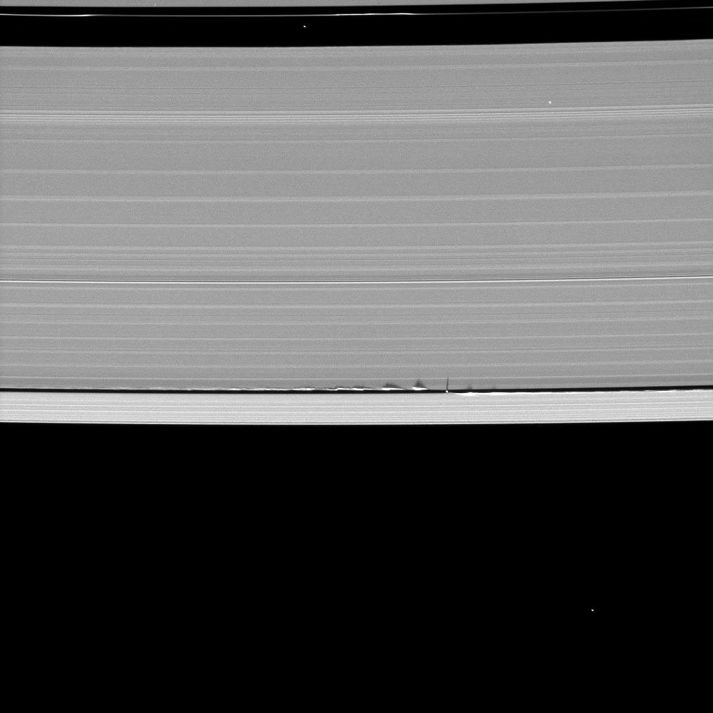 Looming vertical structures created by the tiny moon Daphnis cast long shadows across the rings in this startling image taken by NASA's Cassini spacecraft on May 24, 2009, as Saturn approaches its mid-August 2009 equinox.
