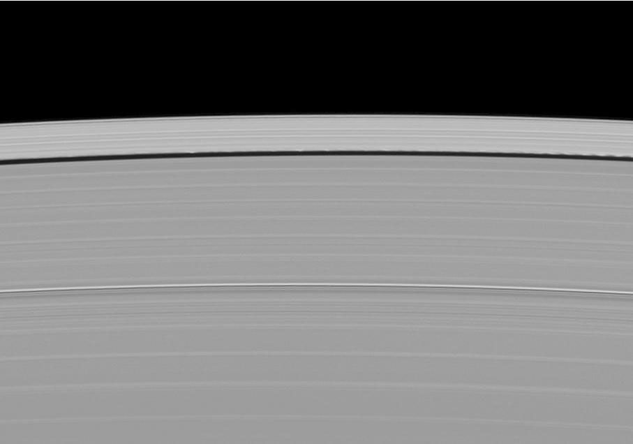 A scalloped look is created in the edges of the Keeler Gap in Saturn's outer A ring as the moon Daphnis orbits in the gap in this image taken by NASA's Cassini spacecraft on May 9, 2009.