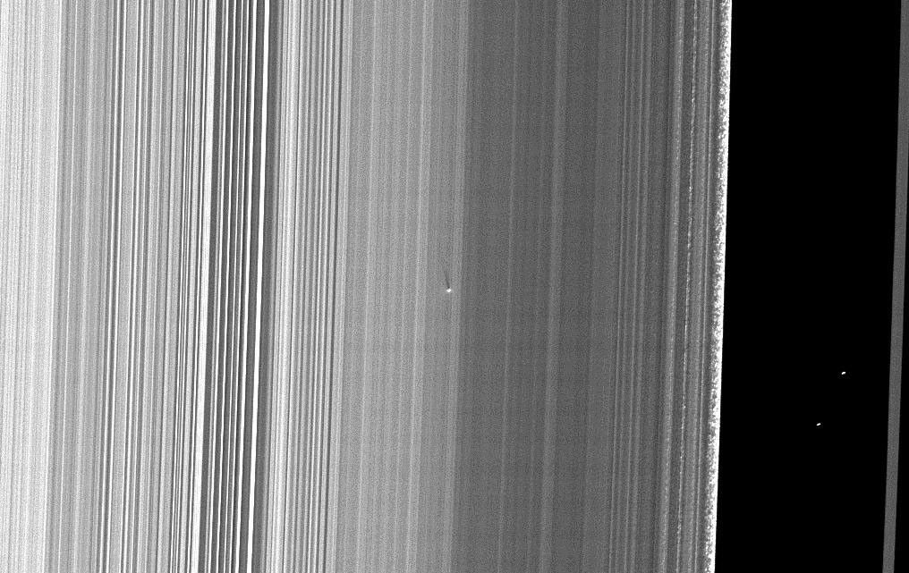 NASA's Cassini spacecraft captured this image of a small object in the outer portion of Saturn's B ring casting a shadow on the rings as Saturn approaches its August 2009 equinox.