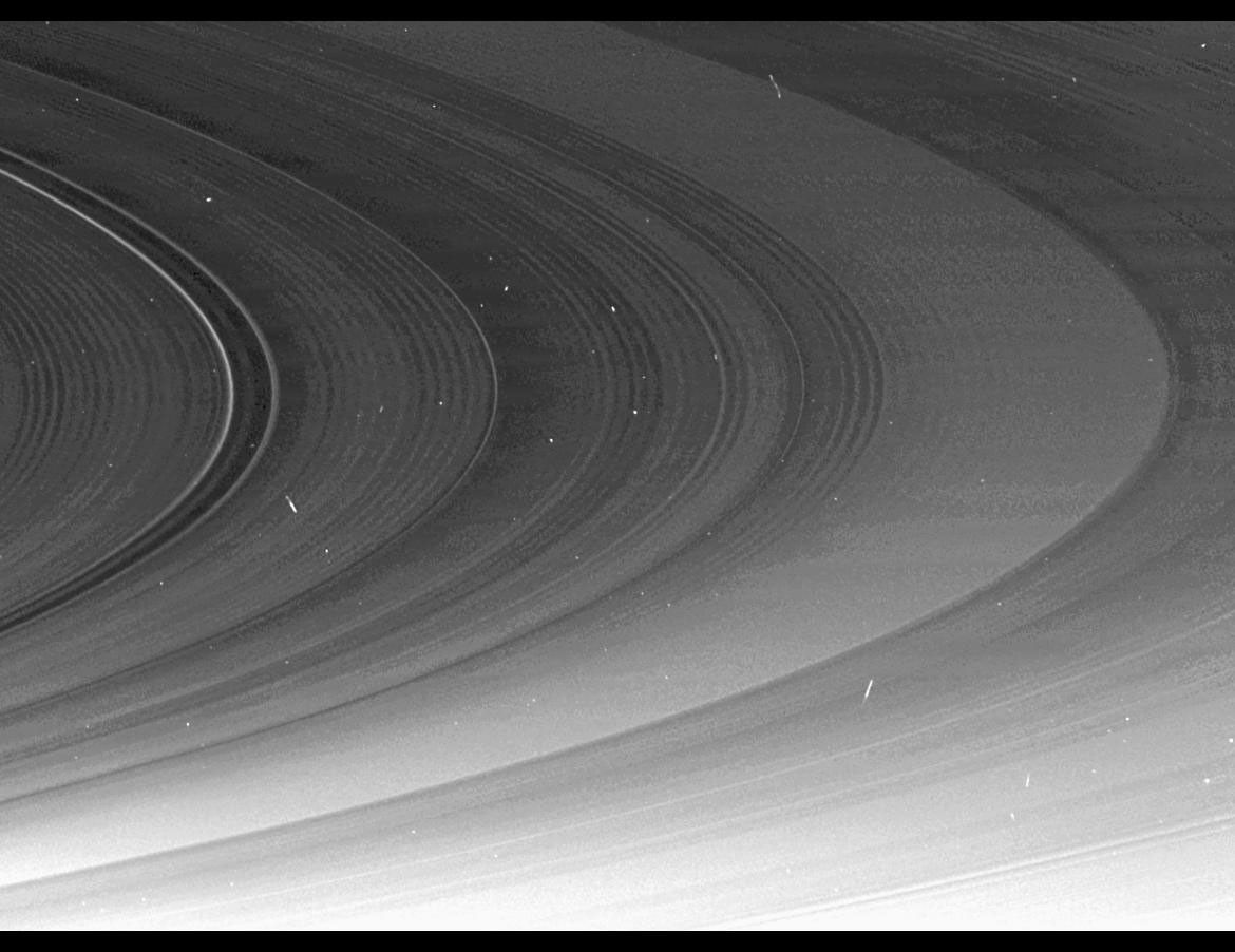 This mosaic, part of a larger mosaic of images captured by NASA's Cassini Orbiter just hours before exact equinox at Saturn, shows that the spiral corrugation in the planet's inner rings continues right up to the inner B ring.