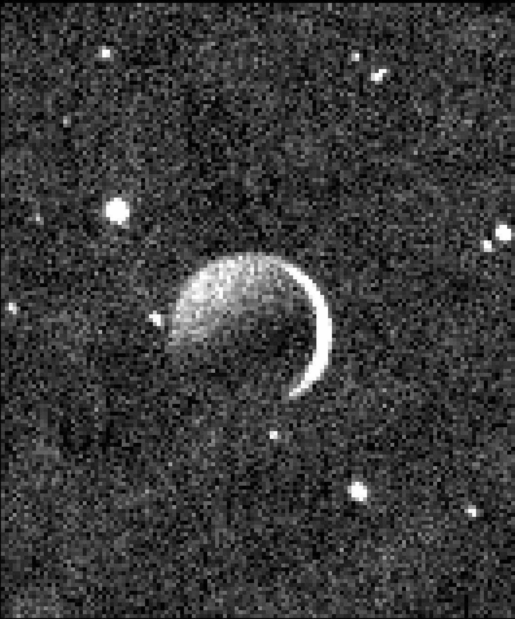 This image obtained by NASA's New Horizons spacecraft shows the night side of Pluto's large, Texas-sized moon Charon, against a star field, lit by faint, reflected light from Pluto itself.