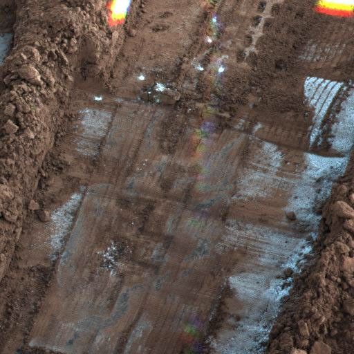 NASA's Phoenix Mars Lander took this shadow-enhanced false color image of frost on the 'Snow White' trench, on the eastern end of Phoenix's digging area taken on Oct. 20, 2008.