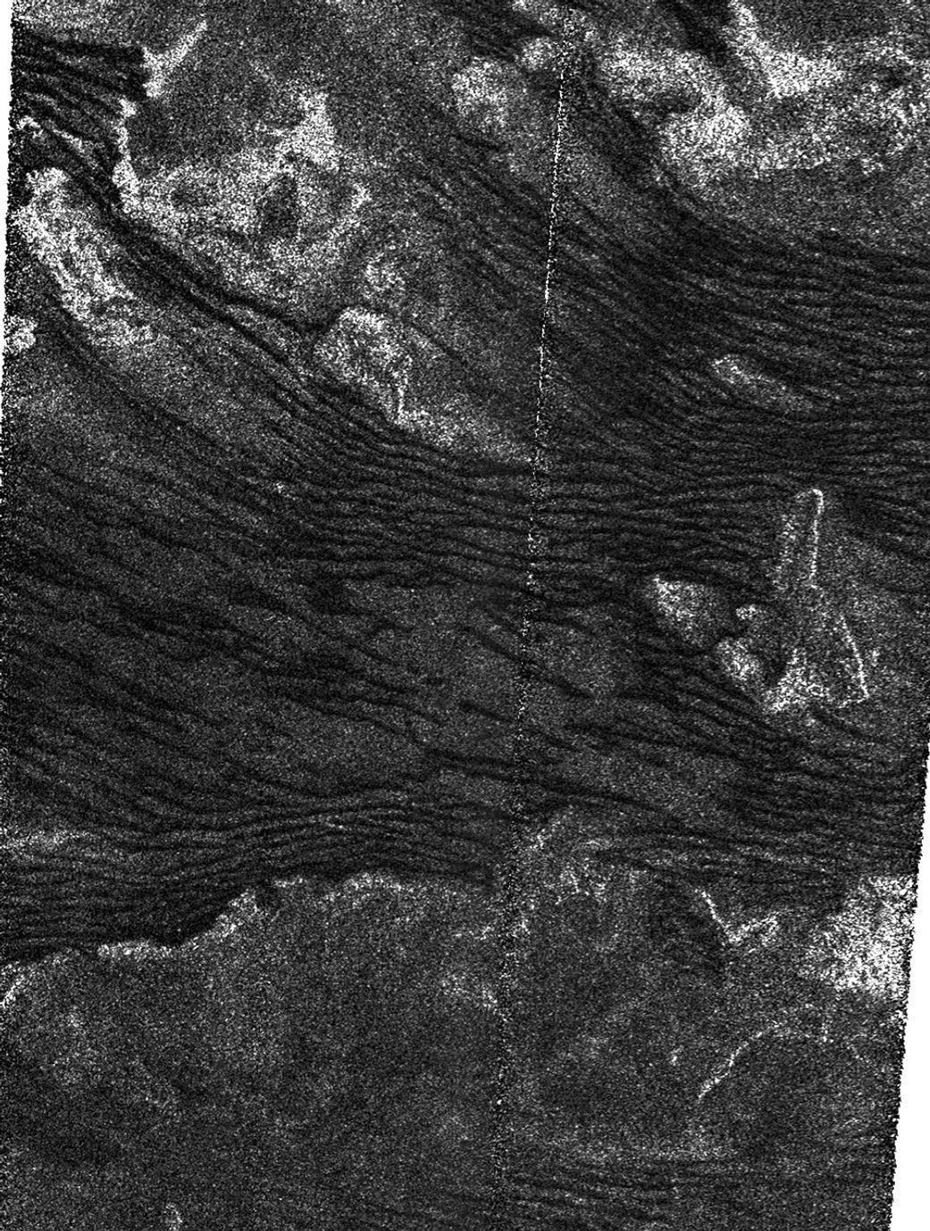 This is a portion of a Cassini radar mapper image obtained by NASA's Cassini spacecraft on its Dec. 21, 2008, flyby of Saturn's moon Titan. The area shown covers the southern boundary of an equatorial band where longitudinal dunes are pervasive.