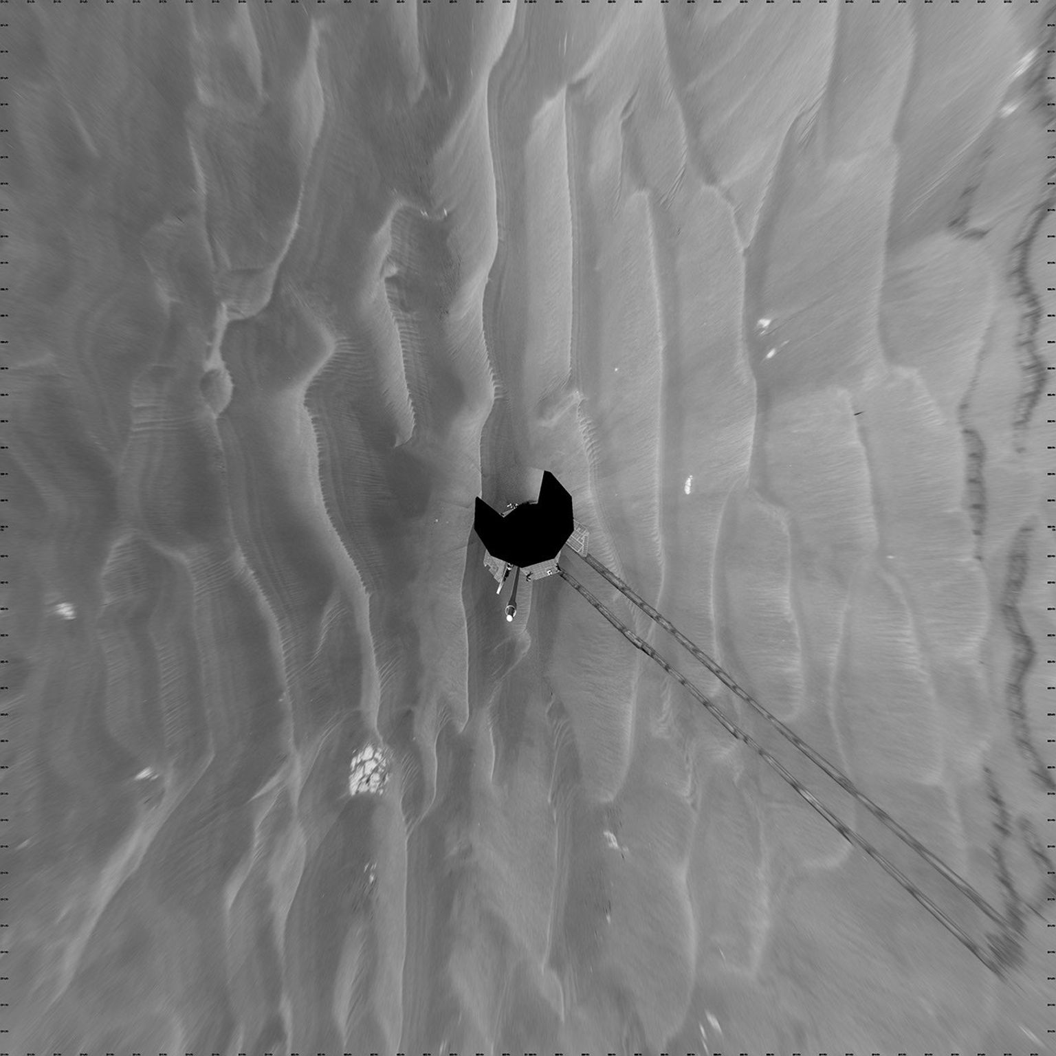 NASA's Mars Exploration Rover Opportunity took images combined into this vertical full-circle view of Mars' Meridiani Planum region includes dark-toned sand ripples and small exposures of lighter-toned bedrock during March 7-9, 2009.