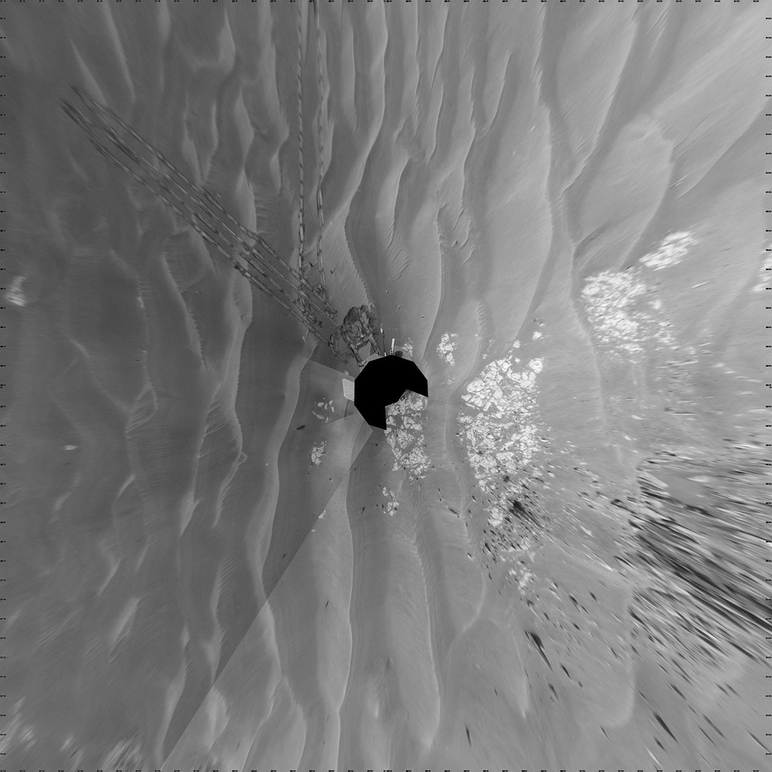 NASA's Mars Exploration Rover Opportunity took images combined into this vertical full-circle view of Mars' Meridiani Planum region includes dark-toned sand ripples and small exposures of lighter-toned bedrock during March 12, 2009.