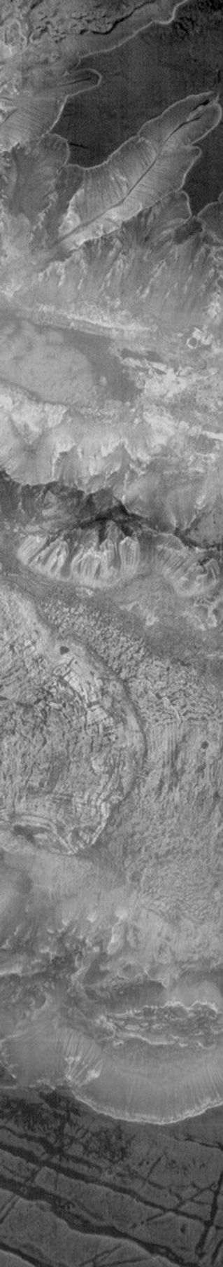 This image from NASA's Mars Odyssey shows Ius Chasma on Mars taken at night. Bright surfaces are warmer than dark surfaces; the floor of the chasma is warmer than the plains at the top of the frame.