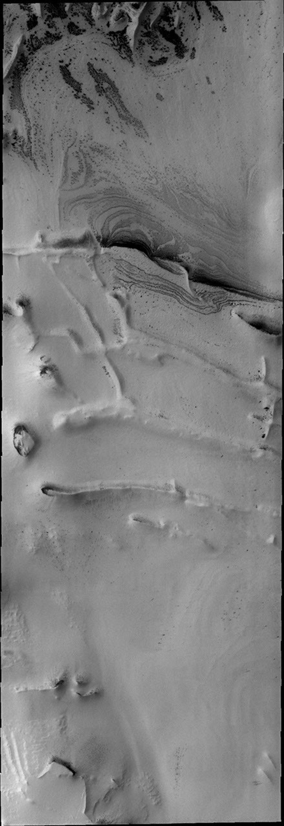 Intersecting linear ridges are found in several locations around the south polar cap on Mars as seen by NASA's Mars Odyssey spacecraft.