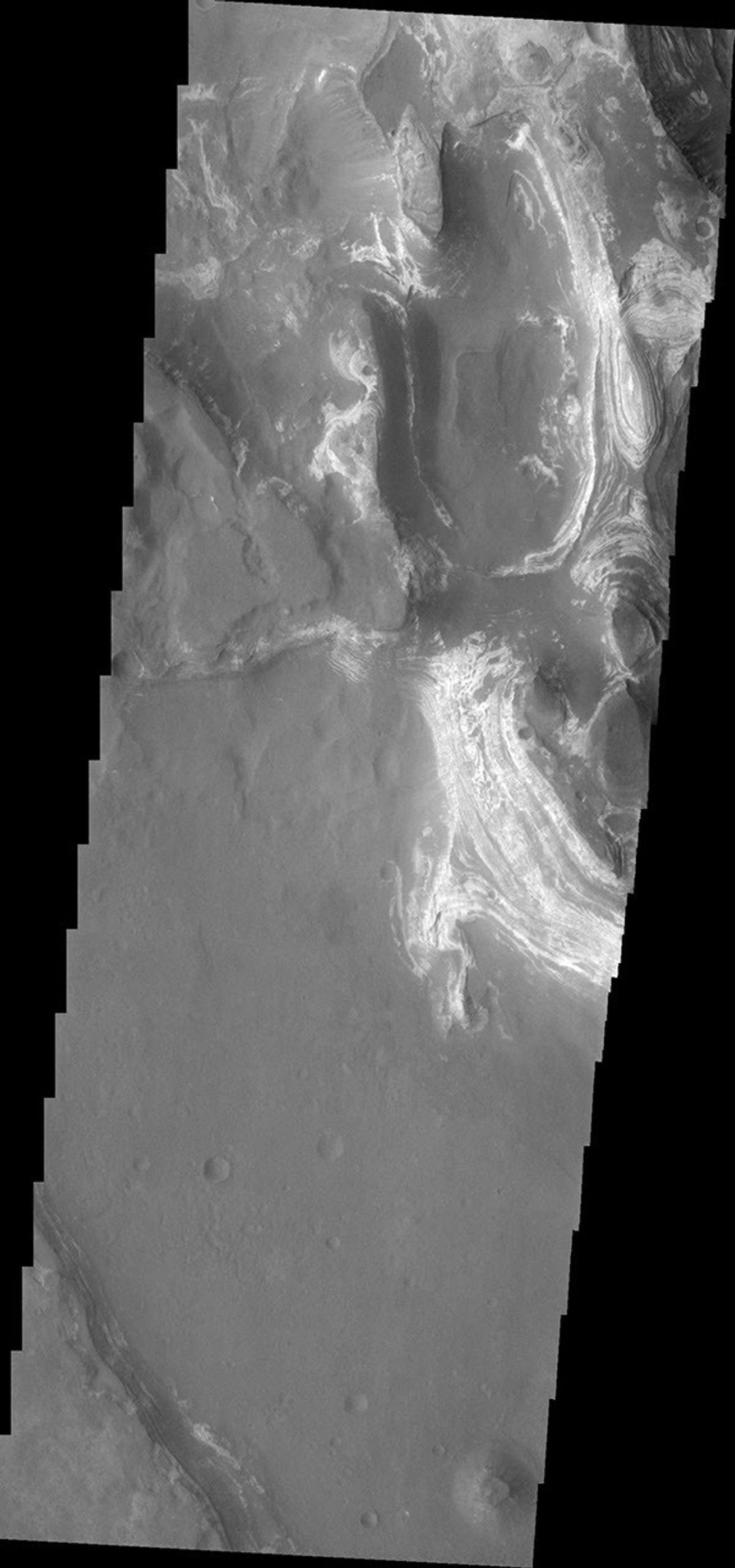 This image shows some of the eroded, layered crater fill material within Terby Crateron Mars as seen by NASA's Mars Odyssey spacecraft.