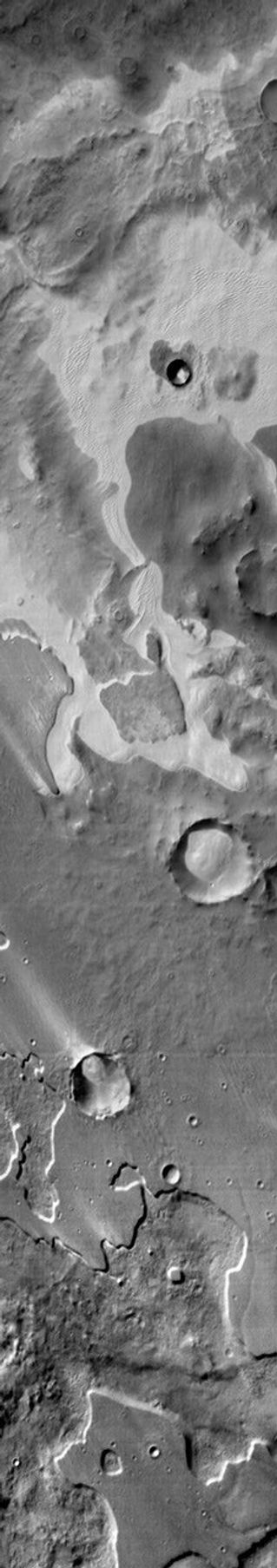 An extensive sand sheet and dunes are located within Pityusa Patera on Mars. This daytime infrared image shows that the sand is relatively warmer than the surrounding materials as seen by NASA's Mars Odyssey spacecraft.