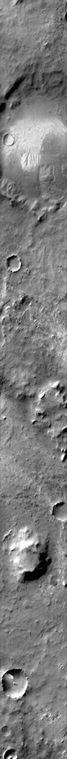 Dunes with several different forms are found on the floor of this unnamed crater in Noachis Terra on Mars as seen by NASA's Mars Odyssey spacecraft.