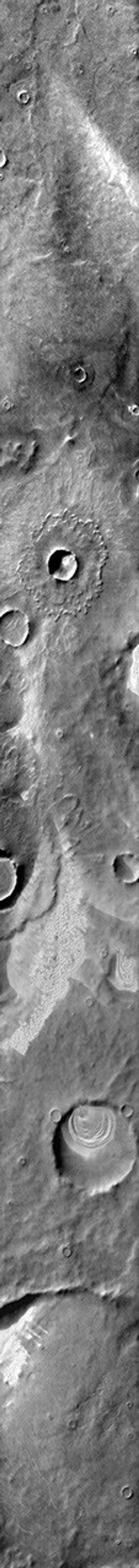 This 2001 Mars Odyssey daytime infrared image shows dunes found in craters and on the plains of Terra Cimmeria on Mars.