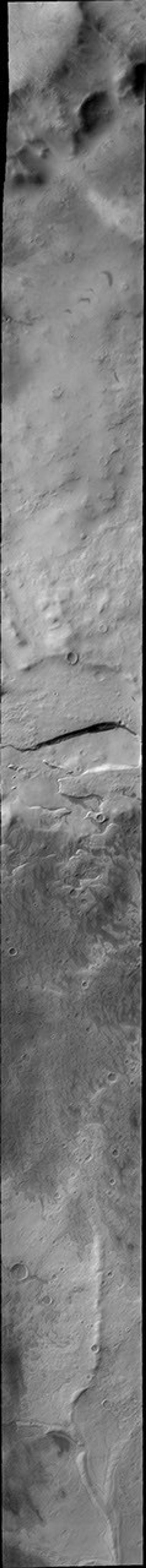 This 2001 Mars Odyssey image shows Promethei Planum, located near Mars' south polar cap, containing many different surface textures.