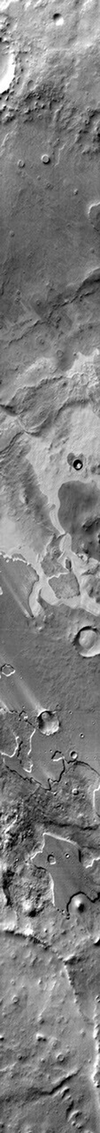 This Mars Odyssey image of Pityusa Patera on Mars shows sandy material trapped in depressions and blown into dune forms.