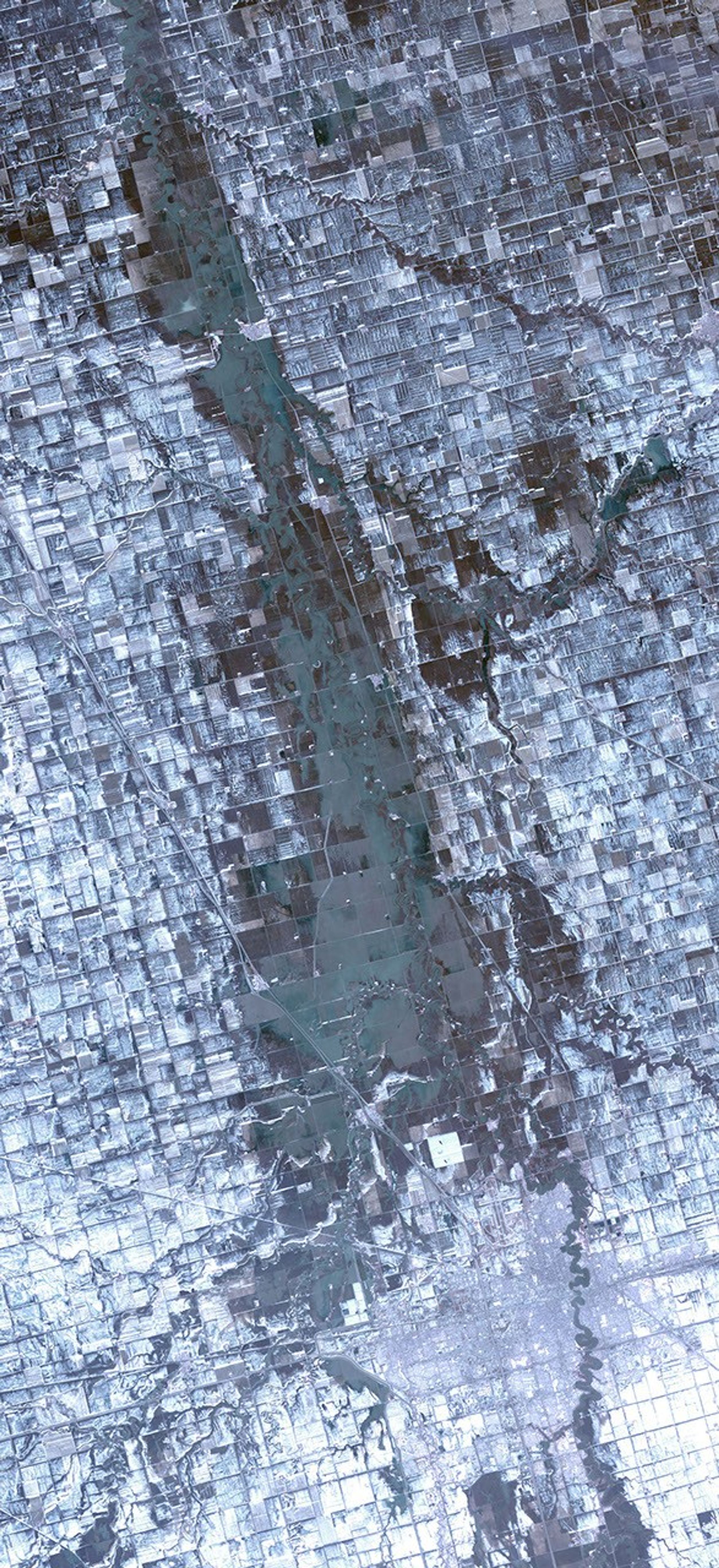 The Spring, 2009 floods along the Red River between North Dakota and Minnesota affected cities in the two states, especially Fargo and Whitehead. NASA's Terra spacecraft acquired this image on April 9, 2009.