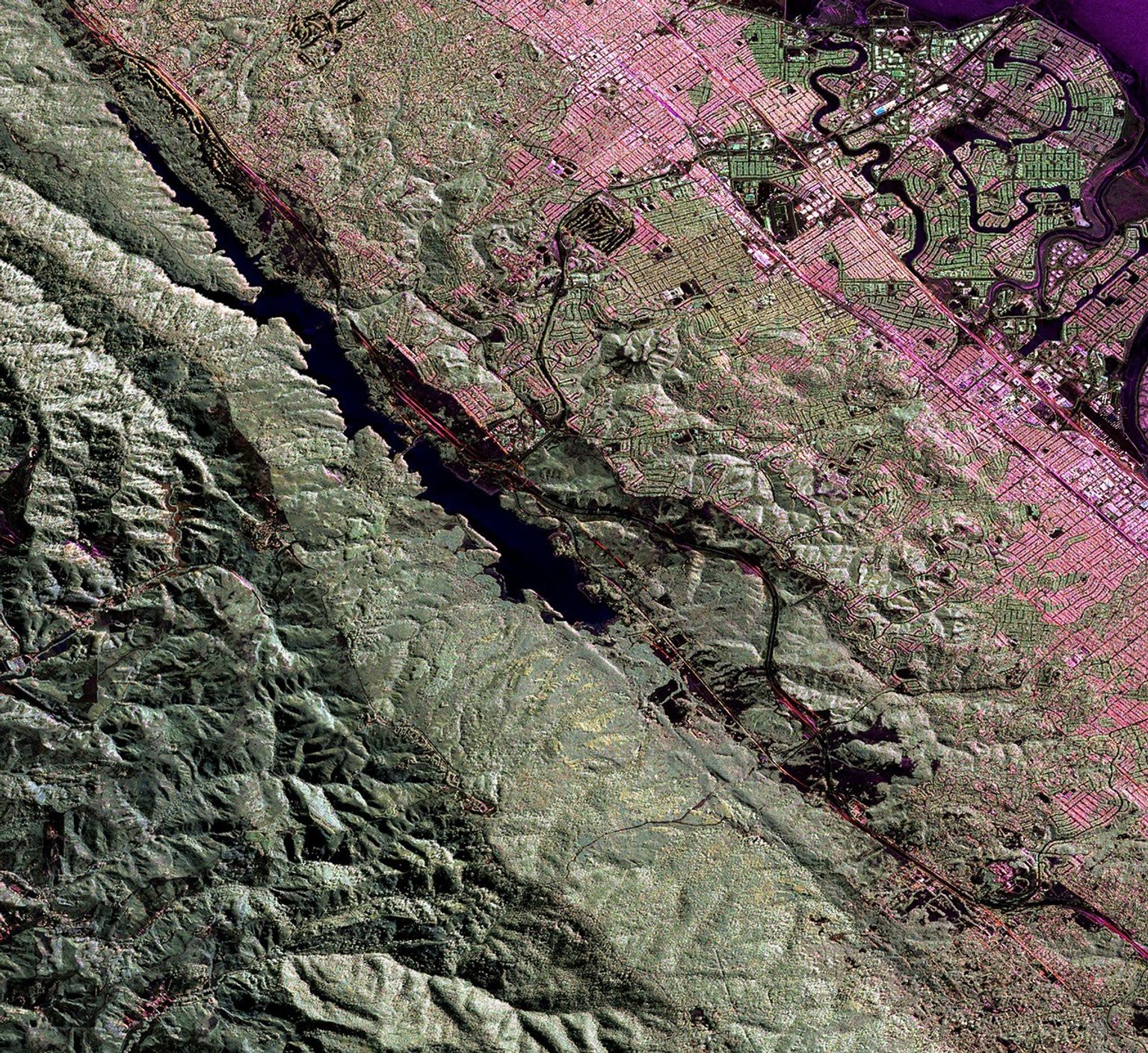 This image is a false-color composite of three channels from data acquired by NASA's Uninhabited Aerial Vehicle Synthetic Aperture Radar over the San Andreas Fault west of San Mateo, California.