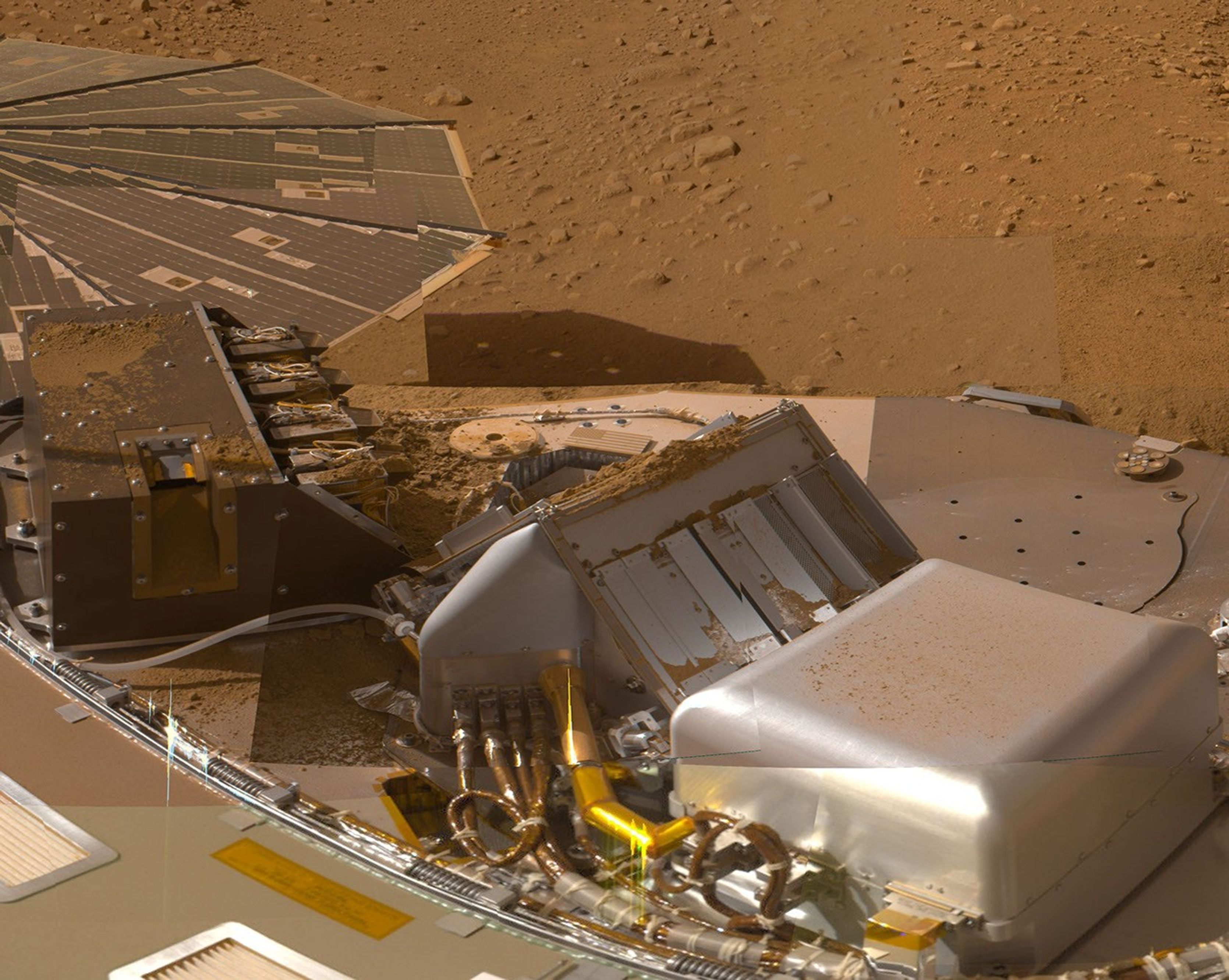 This mosaic of images from the Surface Stereo Imager camera on NASA's Phoenix Mars Lander shows a portion of the spacecraft's deck after deliveries of several Martian soil samples to instruments on the deck.