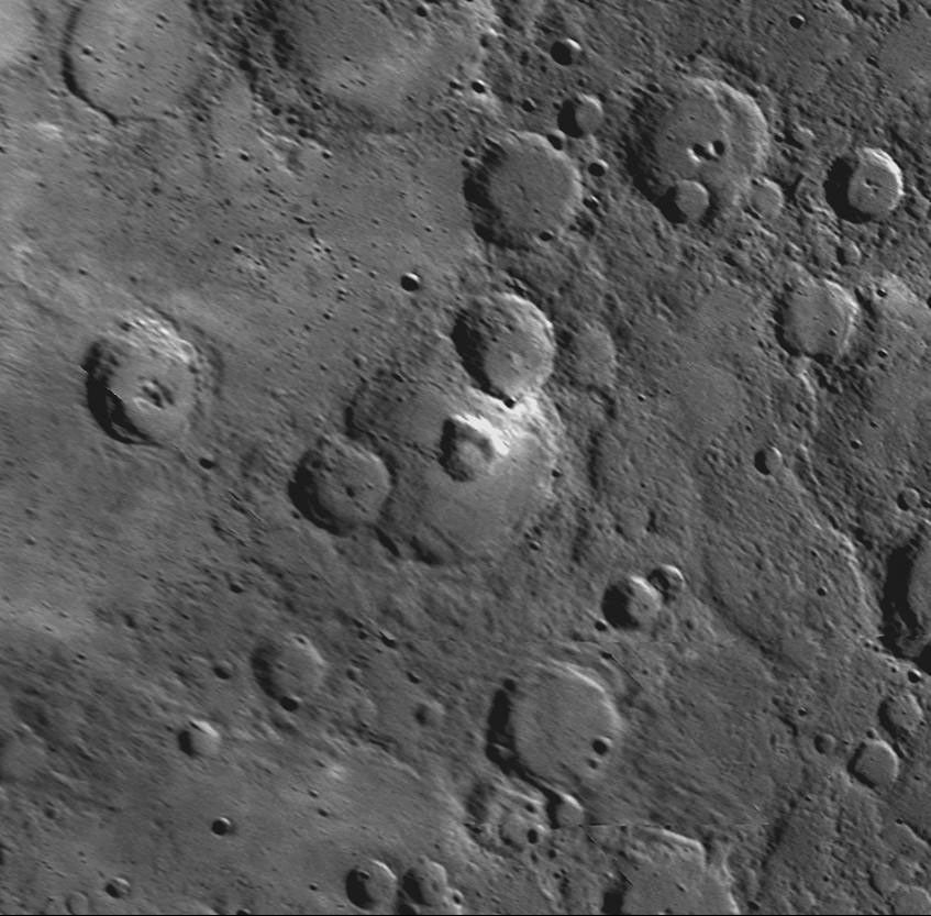 This MESSENGER NAC shows a crater at the center of this image contains a large, nearly circular pit crater.