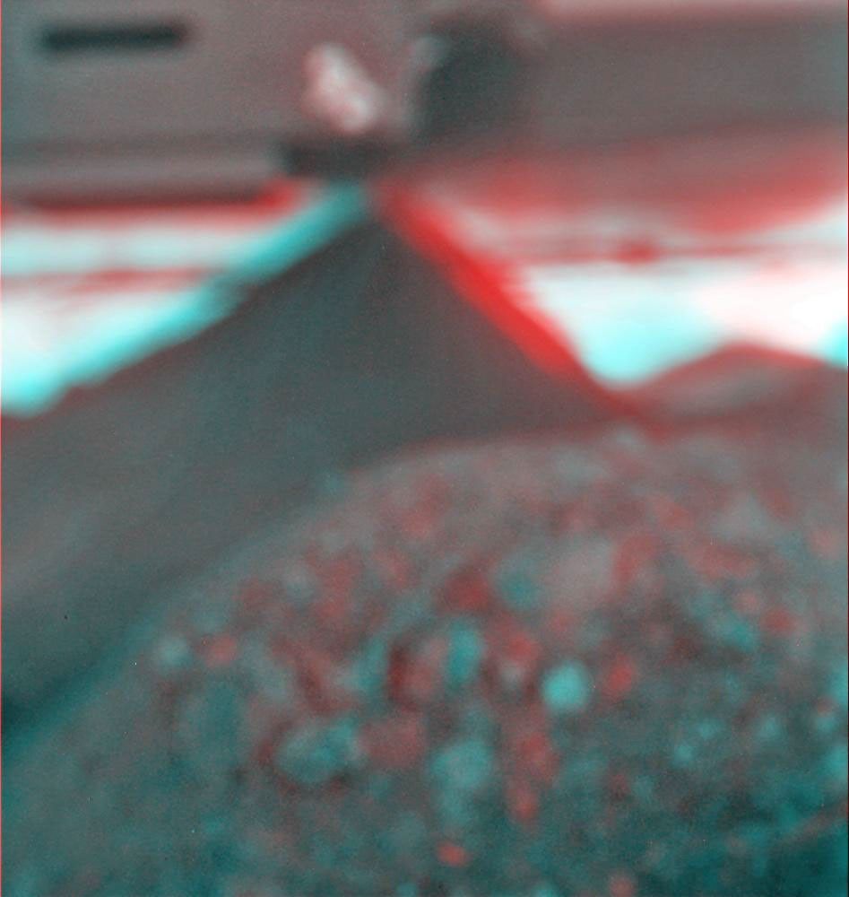 This stereo view combines a pair of images taken two months apart by the microscopic imager on NASA's Mars Exploration Rover Spirit. 3D glasses are necessary to view this image.