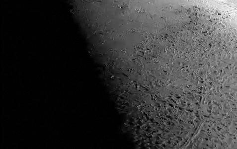 This simulated voyage over the surface of Neptune's large moon Triton was produced using topographic maps derived from images acquired by NASA's Voyager spacecraft during its August 1989 flyby, 20 years ago this week.