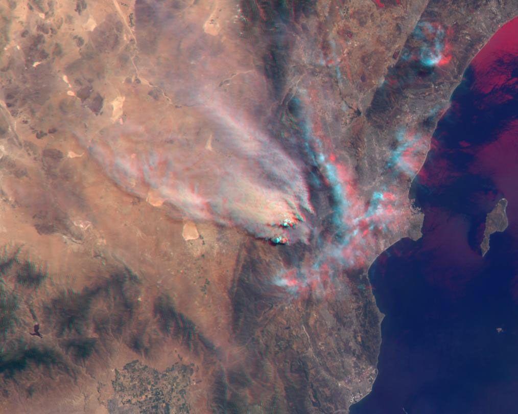 NASA's Terra satellite took this anaglyph of several pyrocumulus clouds, created by the Station Fire, visible above the smoke plumes rising from the San Gabriel Mountains north of Los Angeles. 3D glasses are necessary to view this image.