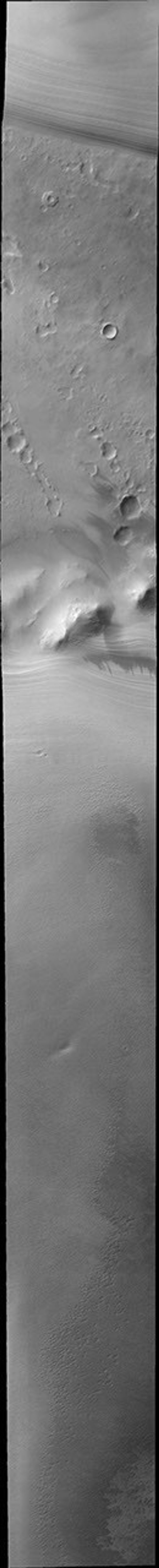 This image from NASA's Mars Odyssey shows multiple layers at the end of Mars' polar cap as summer ends at the south pole.