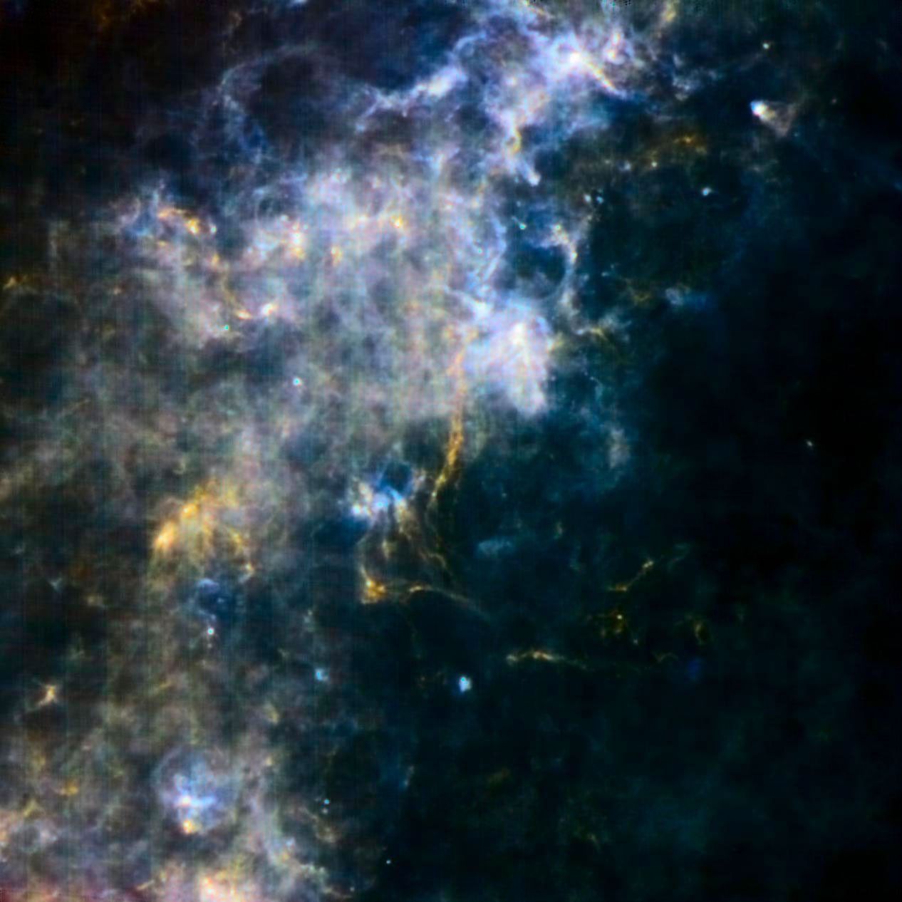 This image from the Herschel Observatory, a European Space Agency mission, reveals some of the coldest and darkest material in our galaxy. The yellow filaments show the coldest dust dotted with the youngest embryonic stars.