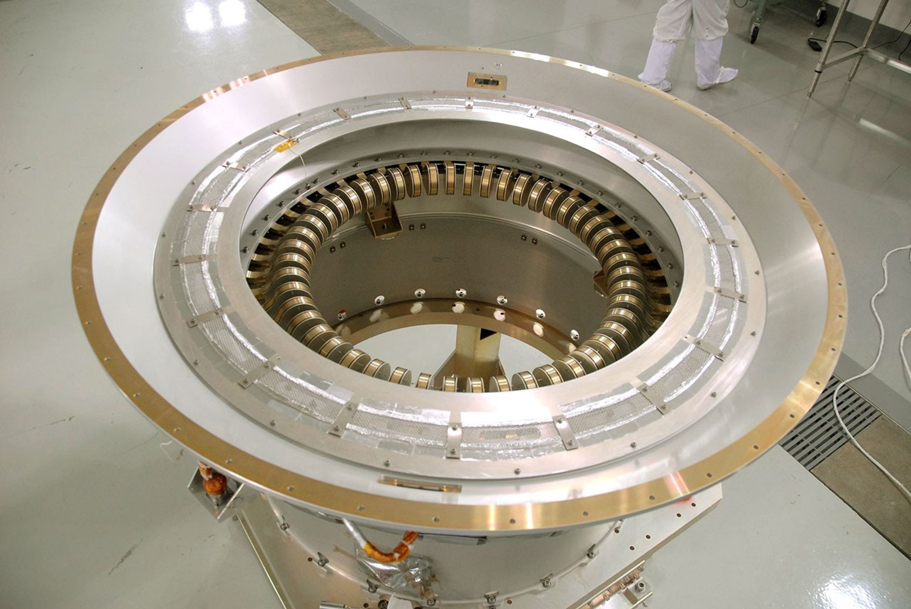 A view of the flexure springs in the soft ride being mated to the payload attach fitting for NASA's Wide-field Infrared Survey Explorer, or WISE, spacecraft.