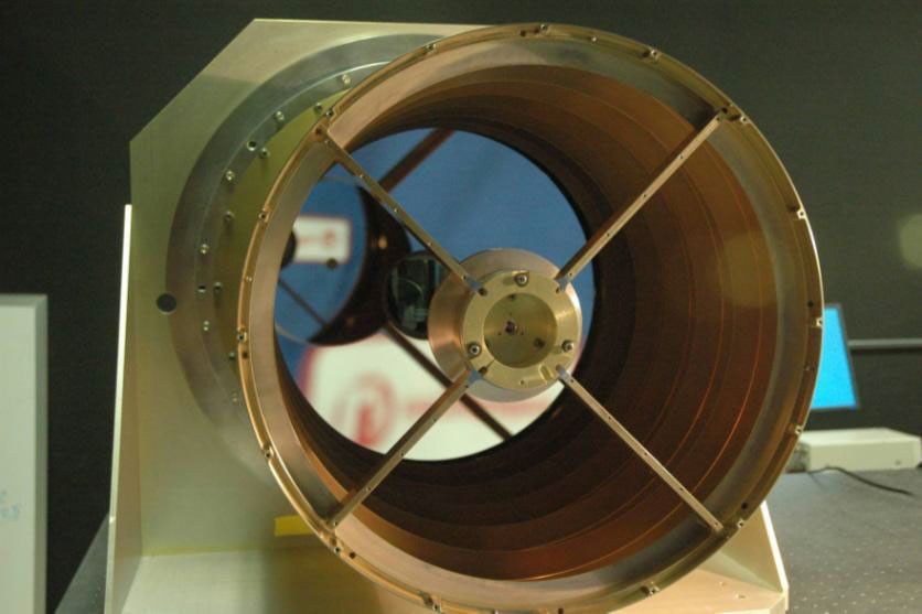 View looking down the barrel of NASA's Wide-field Infrared Survey Explorer telescope. This image shows the 40 cm WISE primary mirror, which is the largest optical element in the WISE system.