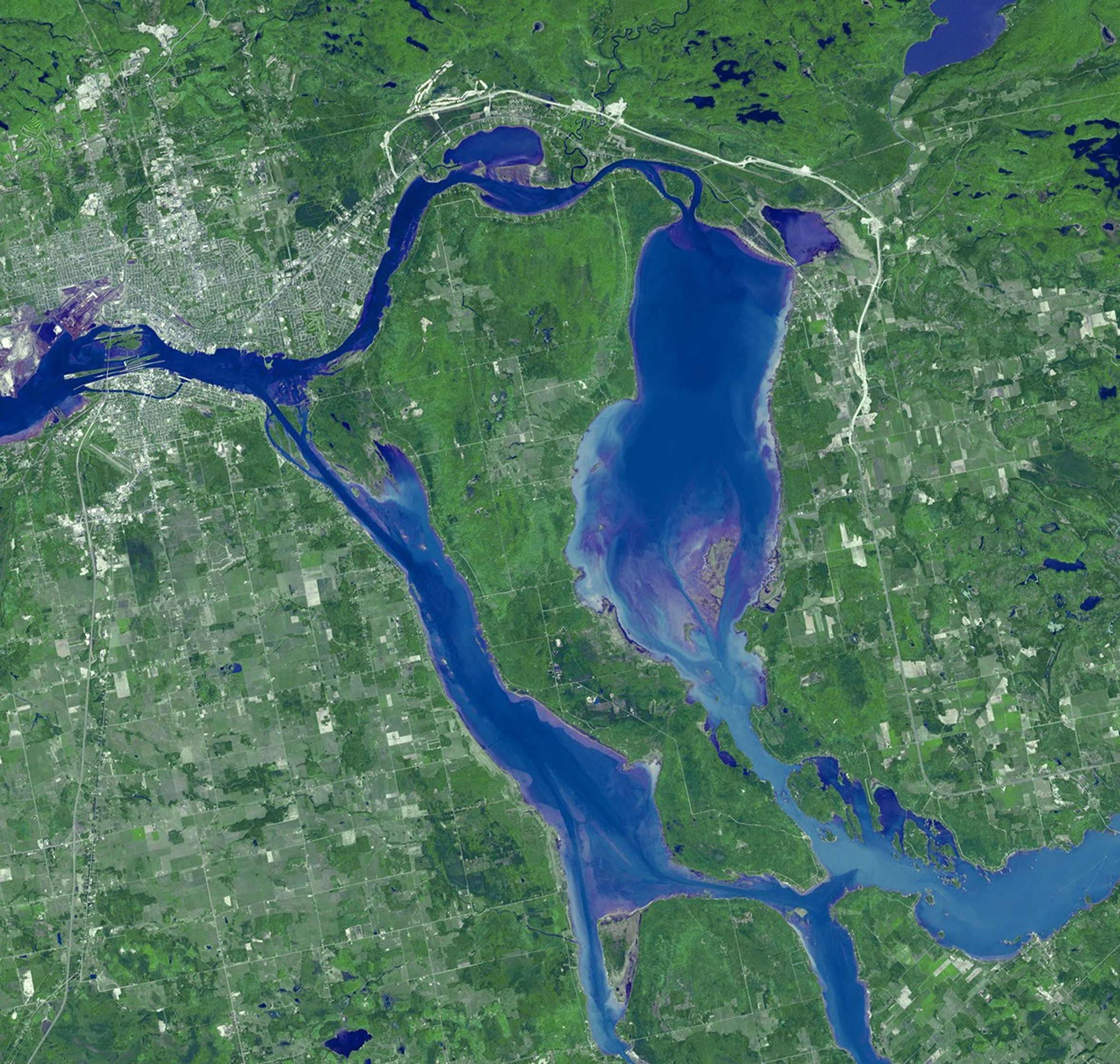 Sault Ste. Marie is the name of two cities on Saint Mary's River, separating Canada and the State of Michigan in the United States. This image was acquired by NASA's Terra spacecraft on June 10, 2007.