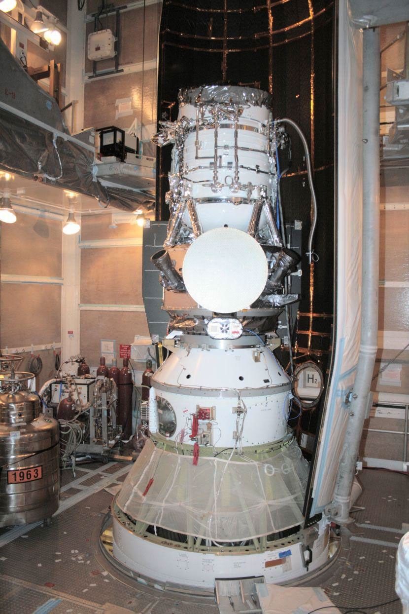 NASA's Wide-field Infrared Survey Explorer is shown inside one-half of the nose cone, or fairing, that will protect it during launch.