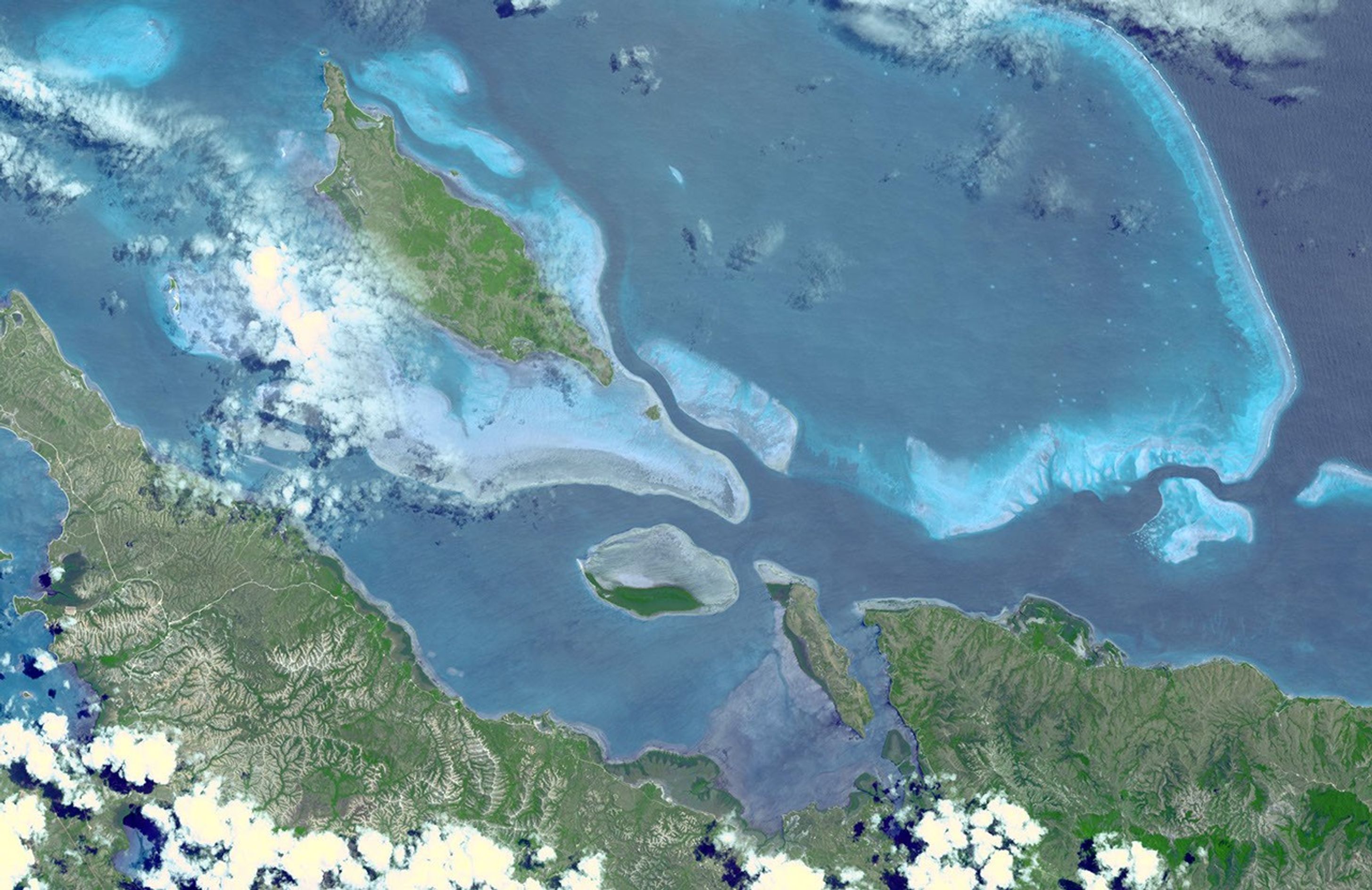 In this image, taken by NASA's Terra spacecraft, six marine clusters represent the main diversity of coral reefs and associated ecosystems in the French Pacific Ocean archipelago of New Caledonia.