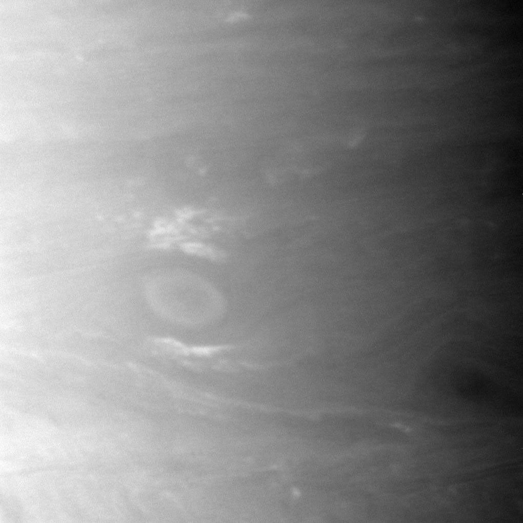 A large storm roils Saturn's atmosphere on the left of this NASA Cassini spacecraft image. This view looks toward a region centered at 24 degrees south of the planet's equator.