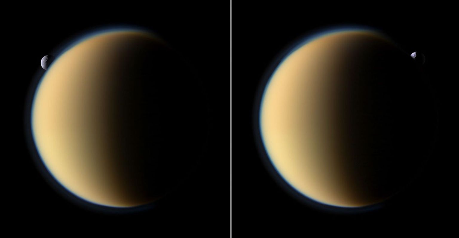 Saturn's moon Tethys with its prominent Odysseus Crater silently slips behind Saturn's largest moon Titan and then emerges on the other side in this image taken by NASA's Cassini spacecraft.